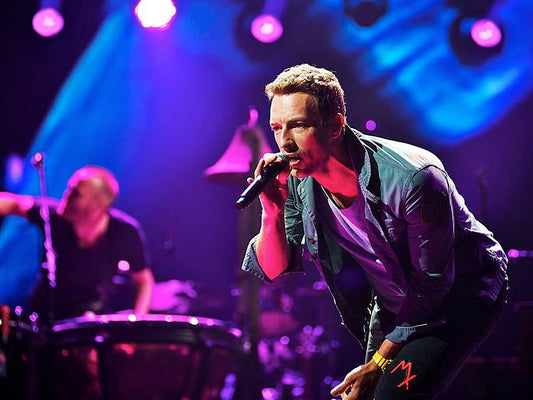 Coldplay’s Chris Martin Jokes About a Couple Hiding on Kiss Cam During Concert